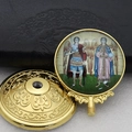 Detailed macro view of two-piece golden religious metal icon with embossed base stand - Gold-12 (Two Religious Figures)