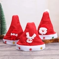 Three Christmas hats with snowman, reindeer and Santa figures on white wood background - Cartoon Christmas Hat for Kids 1pc