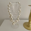 Elegant chunky faux pearl grape necklace with silver lobster clasp on a glass cup - Imitation Pearl Grape Cluster Necklace