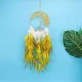 Tree of Life dream catcher with yellow crystals and white feathers on blue backdrop - Yellow Feather + Citrine
