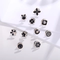 Set of 10 black and gold enamel pins featuring rabbits and flowers in premium metal finish - Black Cartoon Style