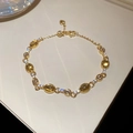 Detail of gold butterfly bracelet with yellow oval stones and heart charm tail chain - 30# Bracelet - Gold-White-Green-Real Gold Plated