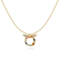 Collier zodiaque Taureau en or avec zircons multicolores sur fond blanc - Taureau