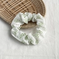 Chic scrunchie hair tie with delicate green floral pattern on cream fabric - White with Green Line Flowers