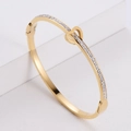 Bracciale in acciaio inossidabile dorato con fibbia a doppio cuore e zirconi incastonati - Oro