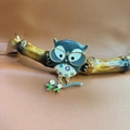 Detailed owl brooch with blue enamel and floral pendant on leather background - Owl - Brooch