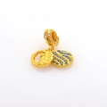 Detailed macro of gold charm pendant with blue stone inlay and floral engraving - Gold Stone Pendants Set