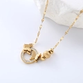 Elegant gold butterfly layered necklace with crystal accents on a white marble background - Gold Necklace