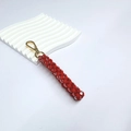 Porte-clés artisanal en paracorde rouge et blanc avec mousqueton doré - Rouge