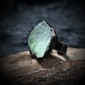 Macro detail of natural green raw stone ring with vintage hammered metal band on wood - Green Fluorite - Unpolished
