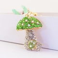 Colorful mushroom keychain with green iridescent rhinestones and gold-tone metal base - Green