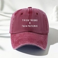 Close-up of THICK THIGHS letter embroidery on vintage washed cotton baseball cap - One Size / Burgundy