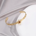 Golden C-shaped stainless steel cuff bracelet with brown stone in sunburst setting - Brown Starburst (B01997-18)