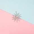 Detailed view of a silver sun-shaped pendant with wavy rays on a colorful background - Wavy Vortex Sun Style (5#)