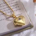 Collana con medaglione a cuore dorato con pendente occhio in zircone e catenina - Motivo Occhio (23346)