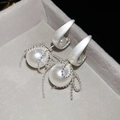 Close-up of pearl earrings with silver beaded tassels on a grey velvet display tray - Silver (925 Sterling Silver Earring Post)