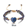 Detailed close-up of handmade woven blue imperial stone bracelet with a heart-shaped pendant - Blue