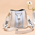 Modern bucket bag with beige and lavender panels and a patterned wide strap - White and Blue