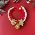 Detailed view of red Christmas pet scarf with velvet bow, gold star and jingling bell - Gold Bow Collar (With Bell)