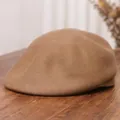 Vintage wool felt beret for women in warm brown color on a textured wood surface - M (56-58cm) / Camel