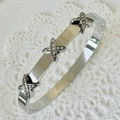 Silver criss-cross bangle with sparkling zircon stones in a polished steel finish - Small X Design Silver Bangle