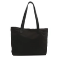 Minimalist black nylon tote bag with leather handles in a clean studio setting - Black