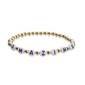 Detail view of hematite stretch bracelet with gold beads and white AMAZING letter charms - 5mm Gold AMAZING Letter