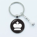 Chess king glass dome keychain with silver metal charm on a clean white background - King Silhouette