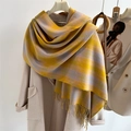 Close-up of yellow and grey plaid scarf with fringes on beige coat - Yellow Grey