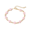 Detail of gold Hamsa Hand bracelet with pink enamel and sparkling white zircons - Pink
