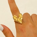 Adjustable gold heart ring with textured lava finish on woman's index finger - 18K Gold Plated Lava Heart (2349)