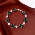Detail of silver vintage bracelet with green clover gems and white zircon flower charms - Emerald Green Clover / Silver-Green