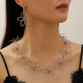 Silver hollow flower jewelry set with oversized necklace and earrings worn by model - Hollow Floral Necklace Earring Set / Silver Set (White K 2pcs)