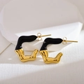 Detail of C-shaped stainless steel earrings with black enamel and irregular gold finish - Black