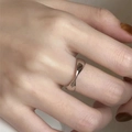 Minimalist 925 sterling silver wave ring with polished finish on model's index finger - JZ0693-Twisted Wave