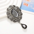 Vintage style black oval gemstone pendant with silver floral filigree and droplet charm - Antique Silver Grey Gem