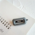 Minimalist grey rectangular hair clip with a smooth finish and black snap closure - Square Gray