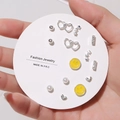 Detail view of a 7-pair silver stud earring set with hearts, stars and yellow smileys - E0496-1 (Mixed Smile Pearl Set)
