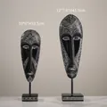 Modern tribal resin mask sculptures with geometric patterns on black stands, 2-piece set - 2-Piece Mask Ornament Set
