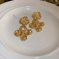 Detail of vintage gold flower stud earrings with layered petals on a white ceramic plate - Irregular Stereo Petals (2#)