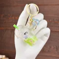 Acrylic milk tea keychain with green liquid, glitters, and a cute penguin charm - Green (Green Milk Tea Penguin)
