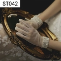 Close-up of white sheer lace wedding gloves with pearl beads on wrist and vintage mirror - White Yarn Beaded Pearl (ST042-Yarn)