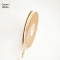 Cream white 1.0cm gold-stamped ribbon with Love Is Eternal text for floral bouquets - 1.0cm Wide x 30 Yards Long / Beige