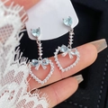 Détail de boucles d'oreilles pampilles en argent avec pierres bleues en cœur et nœud - Coeur Noeud Argent Bleu (16# Tige en Argent)