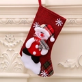 Christmas stocking with snowman applique and plaid details hanging on a fireplace - Linen Medium Stocking (Snowman Style)