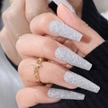 Sparkling silver glitter long coffin press-on nails set shown on model hands - Laser Sparkle Silver