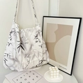 Large paisley canvas tote bag in white and black floral patterns with a shoulder strap - Ink Leaf