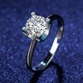 Macro view of four-prong moissanite ring with black metal finish and adjustable band - Adjustable / Style 5 Black Finish Ring (1 Carat)