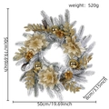 Detail view of 50cm snowy Christmas wreath with golden flowers, berries, and pine cones - 45cm Flocked Wreath