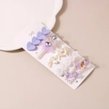 Detailed view of hair clip set with purple hearts, pearls, and rhinestone flowers - Purple System (Style A)